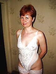 Older cougar taking off her underwear