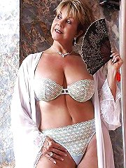 Older mommies getting undressed on camera